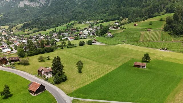 Scenic Aerial View of Rural Countryside and Alpine Landscape Near Flums, Berschis and Walenstadt, Switzerland &ndash; Drone Footage