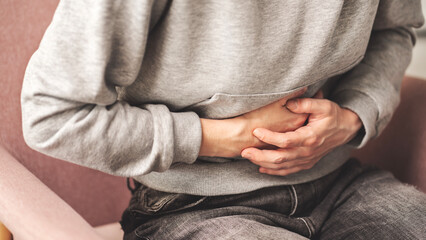 Young woman with stomach ache