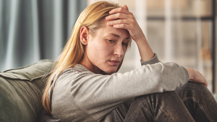 Sad young woman dealing with loss and psychological trauma