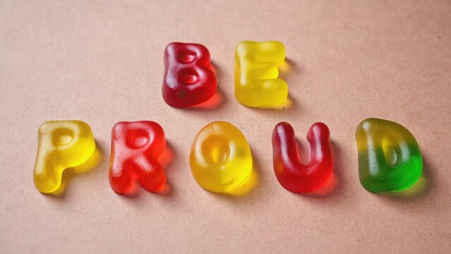 multicolored gummy inscription be proud