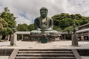 Fototapeta premium Ancient bronze statue of the Great Buddha Daibutsu in Kotoku-in temple, Japan.