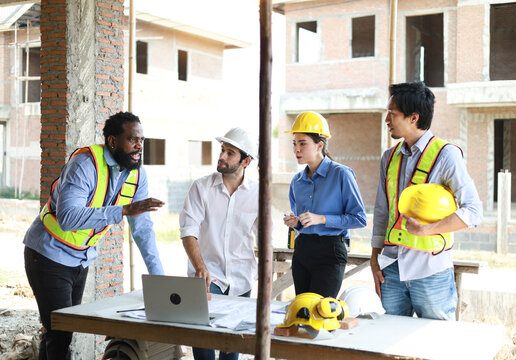 Construction Team Conversation Communication and Laughter with Teamwork and Cooperation of Builders Building Engineers having fun talking about plans at construction site