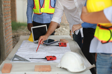 Construction Team Conversation Communication and Laughter with Teamwork and Cooperation of Builders Building Engineers having fun talking about plans at construction site