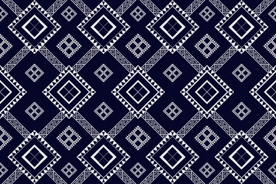 A seamless indigo geometric ethnic pattern inspired by traditional tribal textiles. Perfect for fashion design, fabric printing, home decor, or digital backgrounds. Ideal for use on clothing, scarves,