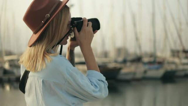 Photographer capturing scenic marina landscape, framing nautical details with creative visual storytelling approach.Travel, blogging, weekend, relax and lifestyle