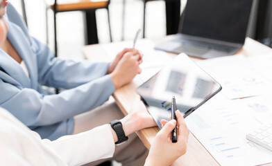 Business people are meeting for analysis data figures to plan business strategies.