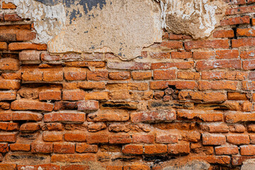 Old Brick Wall with Cracked Plaster