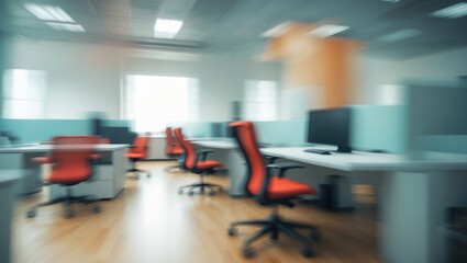 Obraz premium A minimalist tech office with an open floor plan, showcasing sleek white desks, ergonomic chairs, and glass partitions. Blurred image, suitable for design and corporate presentations.