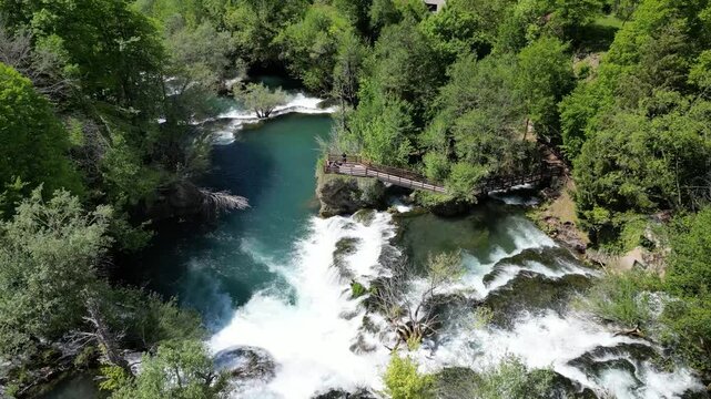 Amazing Martin Brod waterfalls on river Una in Bosnia and Herzegovina. Beautiful nature in Una national park with crystal clear water and amazing cascade waterfalls.