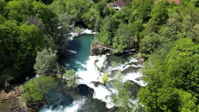 Amazing Martin Brod waterfalls on river Una in Bosnia and Herzegovina. Beautiful nature in Una national park with crystal clear water and amazing cascade waterfalls.