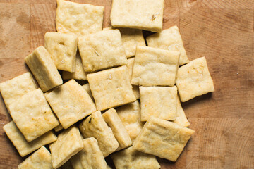 Overhead view of homemade crackers, top view of freshly baked cracker biscuits, process of making crackers
