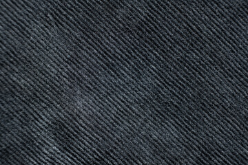 Corduroy fabric composed of cotton with a slight addition of elastane, abstract black fabric background