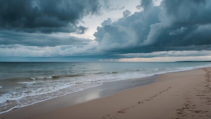 A foggy day at the shoreline with overcast weather and soft sand