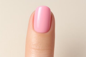 Detailed view of a perfectly polished fingernail with colorful nail polish