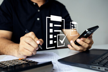 Businessman using smartphone for online checklist and digital document management