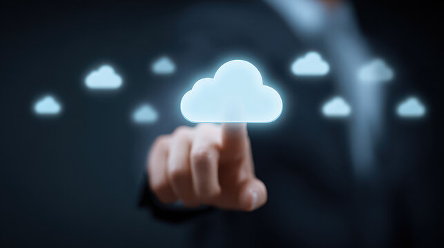 Cloud Technology at Fingertips: An elegant presentation of a user's finger interacting with cloud computing technology. Capturing the innovative link between humans and data.