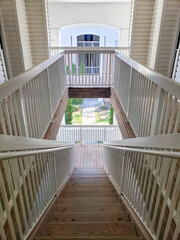 long wooden staircase leading between floors.