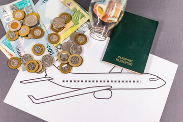 Saving money for travel with a passport and airplane drawing, symbolising accumulation of funds for a trip, wanderlust, planning a journey and travel budgeting.