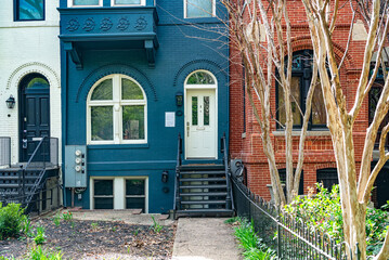 Facade of a typical row townhouse, brick walkway in downtown Washington, DC