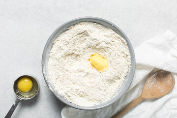 ingredients for making donuts on a marble countertop