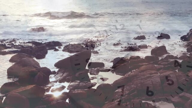 Rocky shoreline waves lapping with clear clock face fading and rotating hands representing time