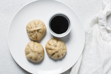 Overhead view of chicken bao, top view of baozi, process of making homemade baozi