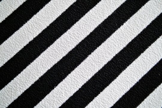 Monochrome Diagonal Stripes: Close-Up of Parallel Lines in Black and White Fabric Texture