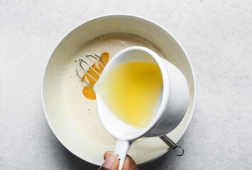 overhead view of Vegetable oil in a measuring cup, top view of vegetable oil for baking