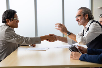 Human resources : company, successful deal. Human resources manager interviewing applicant at modern office.  Asian man candidate job interviewing and answering question hr CV recruiter