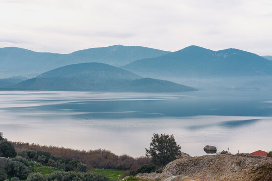 stillness of water and mountains  at bafa lake in turkey, tranquil travel destination