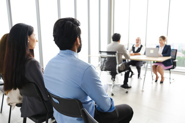 Back view, rear view audience or crowd people : Asian indian business man and diverse audience...