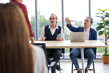 business meetting with laptop computer : Professional business teamwork diverse company people in meeting. Group of colleagues discussion during business meeting in conference room