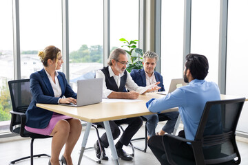 business meetting with laptop computer : Professional business teamwork diverse company people in meeting. Group of colleagues discussion during business meeting in conference room