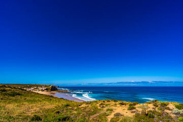 Beautiful Algarve coastline. View of seaside village and  sandy beach Monte Clerigo. Vicentine Coast in Portugal
