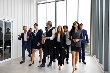 group portrait business team walking : Portrait of successful Caucasian business woman leader and business team Multiethnic people standing together at workplace. Diverse team