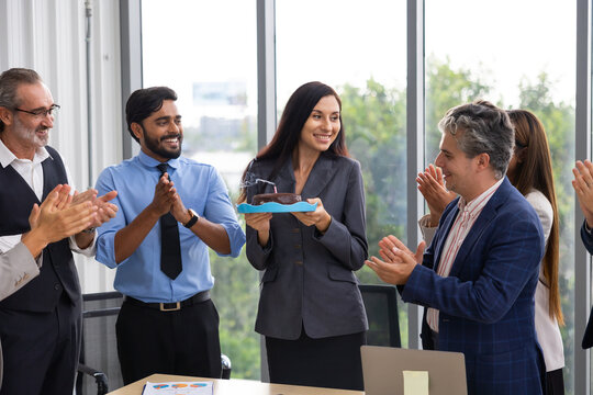 happy birthday party : Business Hispanic woman celebrating birthday and doing a party with colleagues. Multi-Ethnic Coworkers are Celebrating a Birthday Party in the Office.