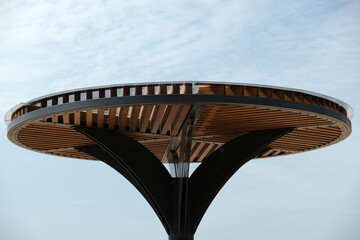 construction of metal pole with wooden slats
