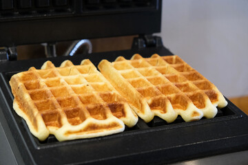 belgian waffles in a waffle iron
