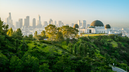 the famous griffith observatory and los angeles skyline during sunrise