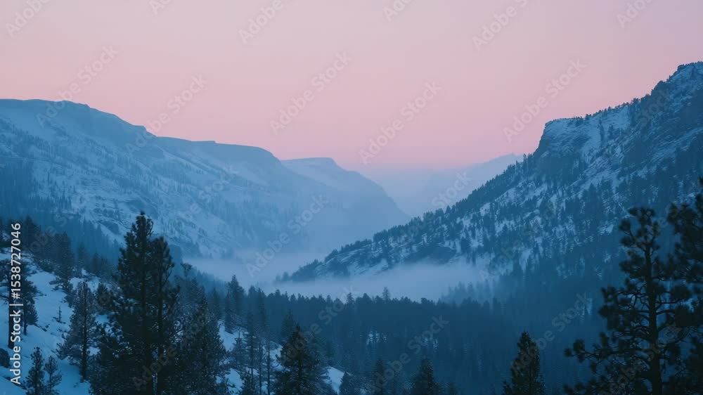 Poster a serene winter landscape featuring a snowy mountain range with trees in the foreground, perfect for