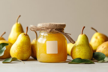 Pears and pear jam in glass jare with blank label on a table