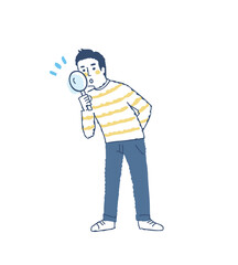 虫眼鏡を覗いている若い男性
