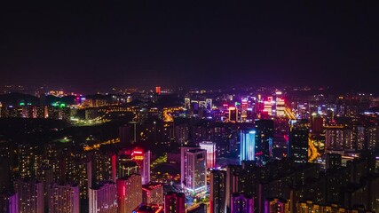 Aerial mobile timelapse captures atmospheric night cityscape of vibrant urban metropolis in china
