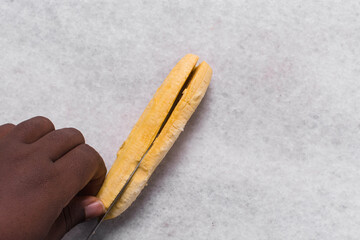 Top view of slices of ripe plantains, slicing yellow plantains for frying, process for making fried plantain	