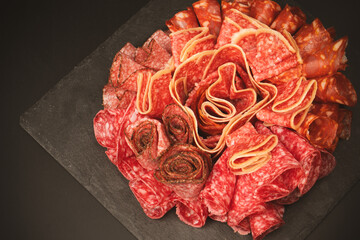 Different kinds of meat cuts on a board.