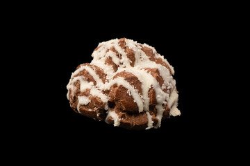 Profiteroles with coconut cream on a black background.