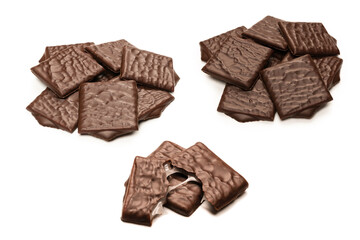 Dark chocolate candies isolated on white background.