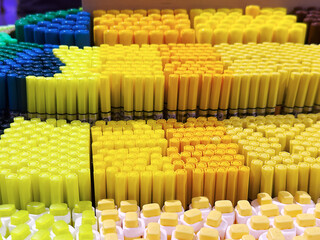 Colorful arrangement of various crayons in vibrant shades of yellow, blue, and green. The scene showcases a creative and artistic concept.