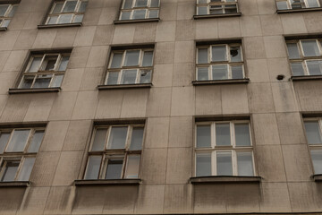The old buildings weathered facade and damaged windows reveal its fascinating past, with intricate...