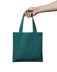 A hand is holding a blue tote bag. The bag is made of a light blue material and is in a person's hand